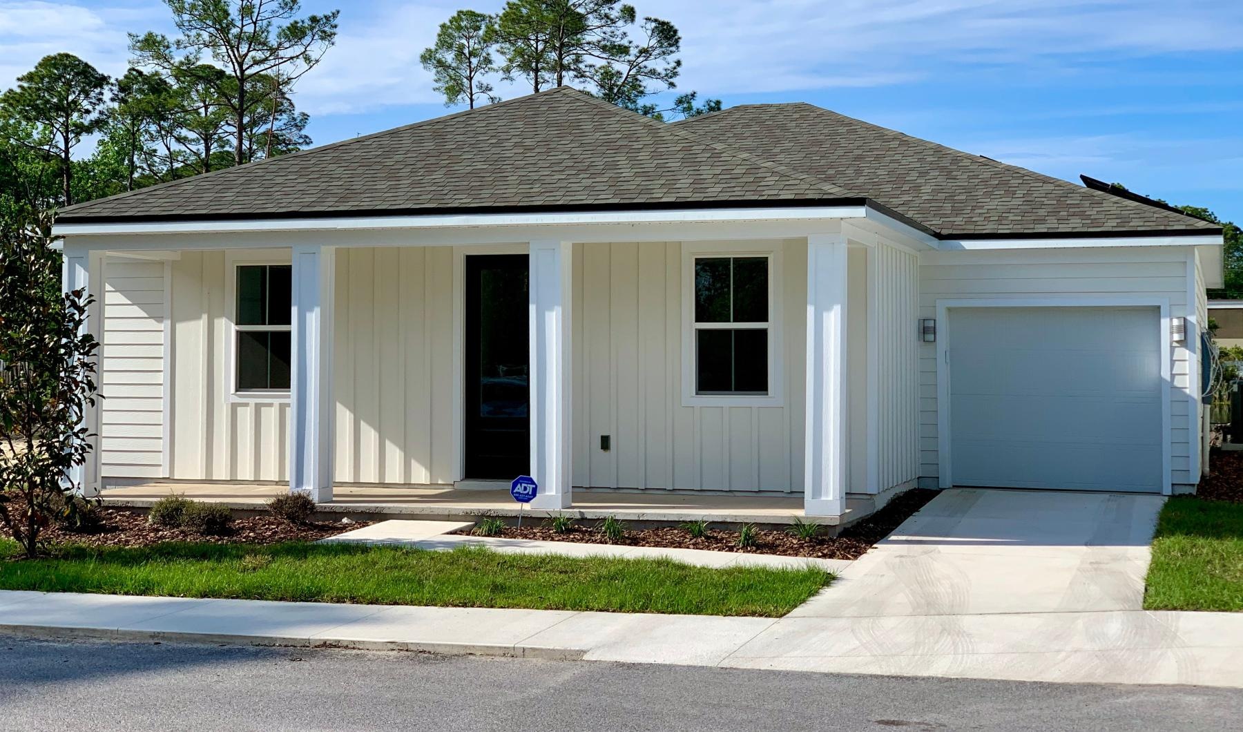 a white house with a garage